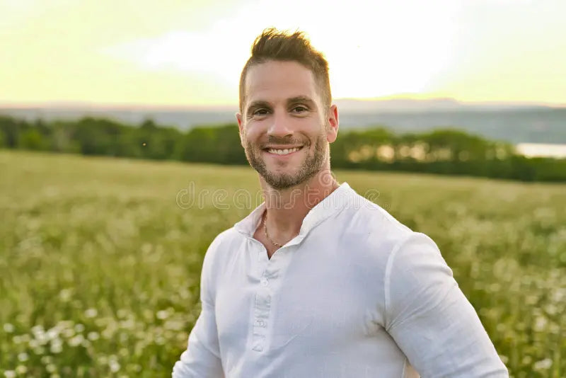 files/happy-smiling-mature-man-looking-camera-outdoor-meadow-199526604.webp