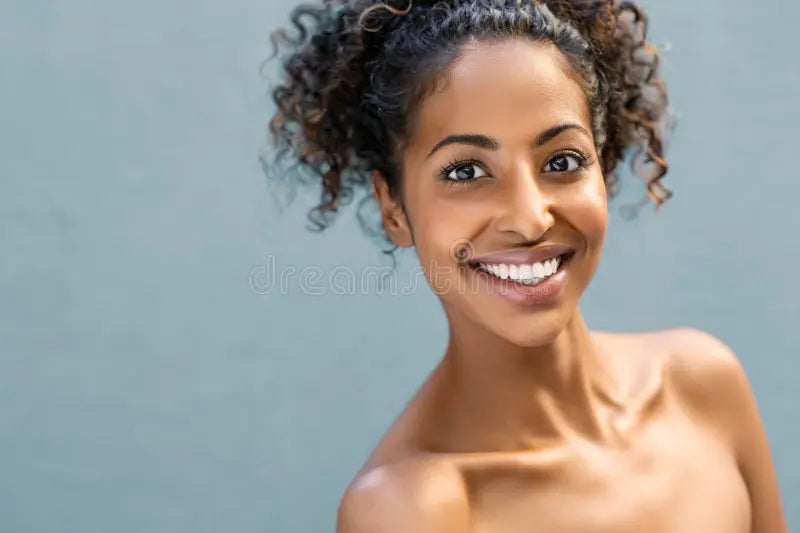 files/smiling-african-american-woman-curly-hair-looking-camera-over-blue-background-copy-space-happy-black-girl-feeling-159264802.webp